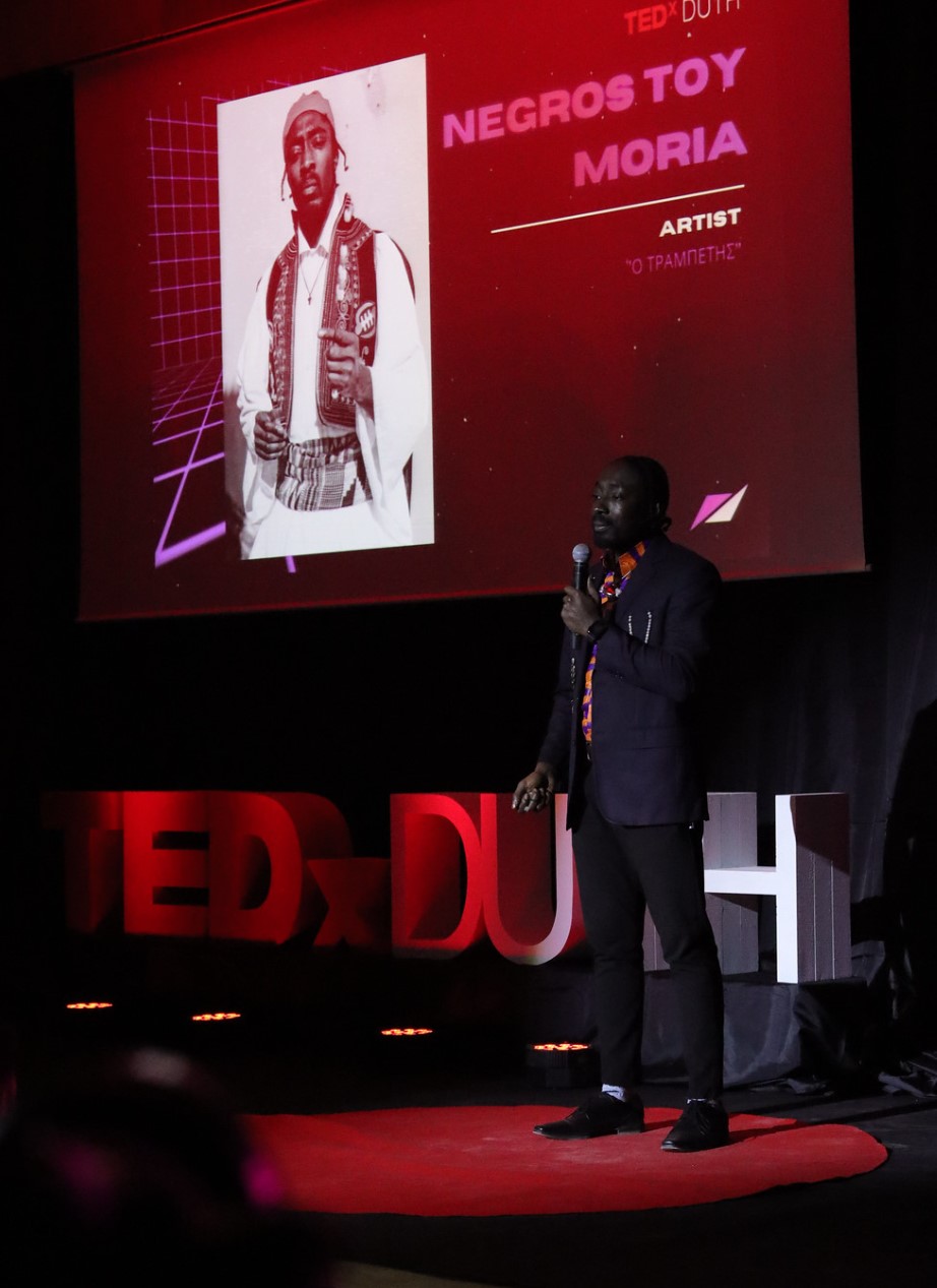 A dynamic speaker on the red dot at TEDxDUTH